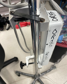 Bottom of iv pole with screws for the removable electric accessory